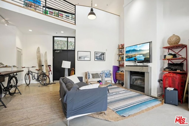 living room with a high ceiling