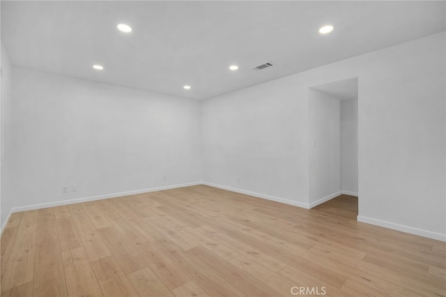 spare room featuring light hardwood / wood-style flooring