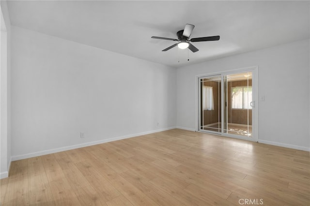 empty room featuring ceiling fan and light wood-type flooring