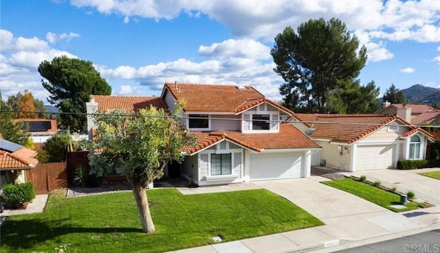 view of front of home featuring a front yard and a garage