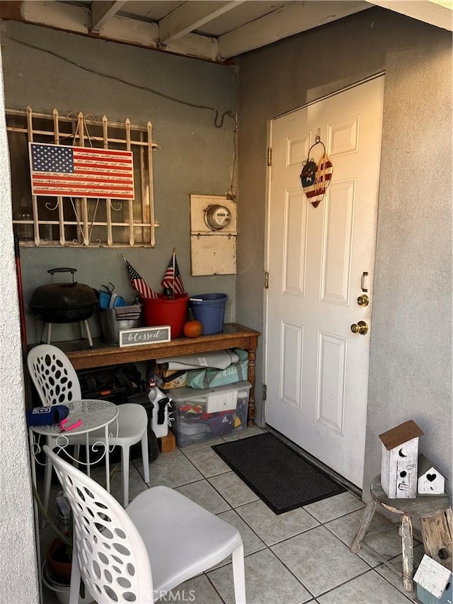 interior space with tile patterned floors