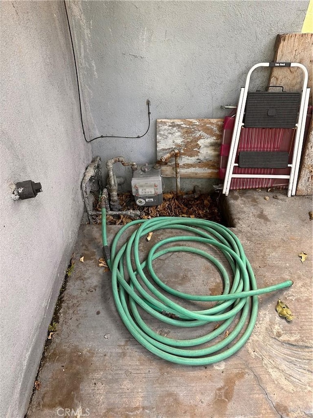 interior details featuring gas meter and a fire extinguisher