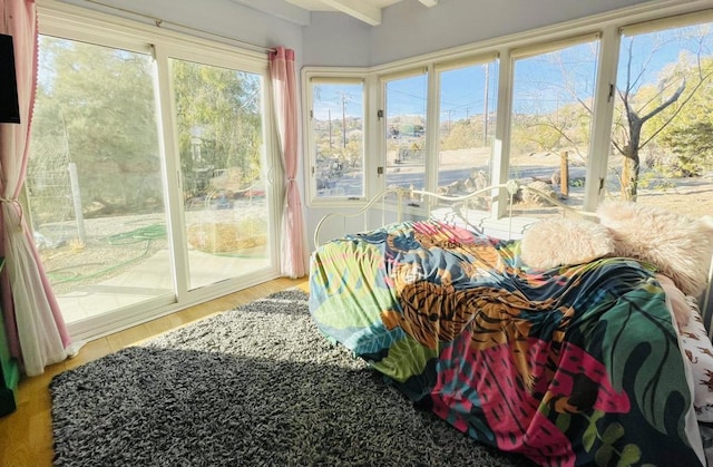 sunroom / solarium with beamed ceiling