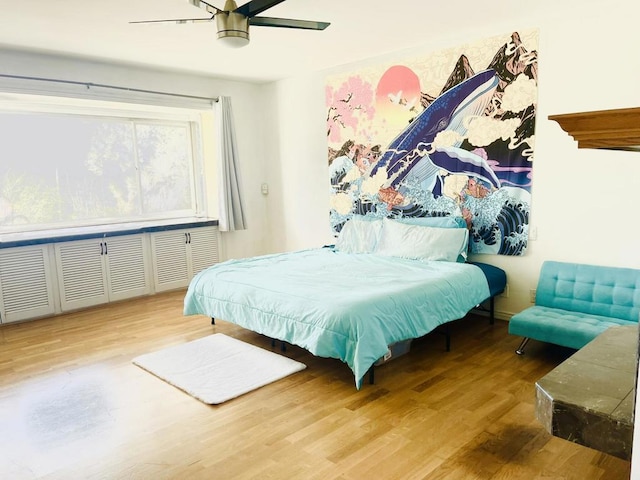 bedroom with ceiling fan and hardwood / wood-style flooring