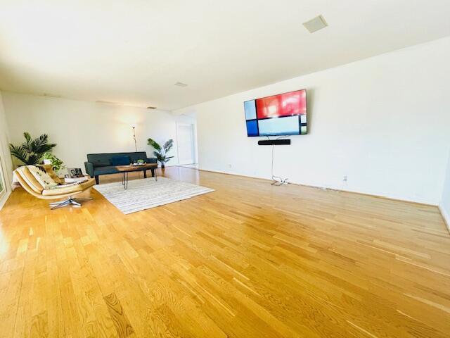 unfurnished living room featuring hardwood / wood-style floors