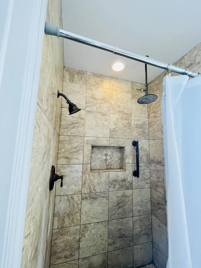 bathroom with a shower with shower curtain