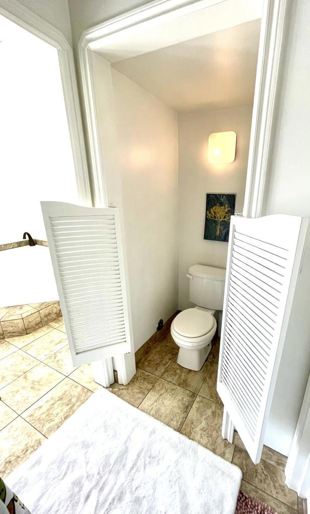 bathroom featuring toilet