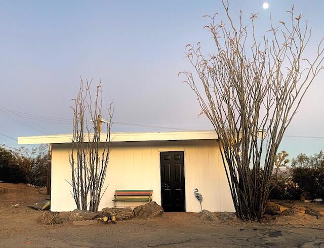 view of outdoor structure at dusk