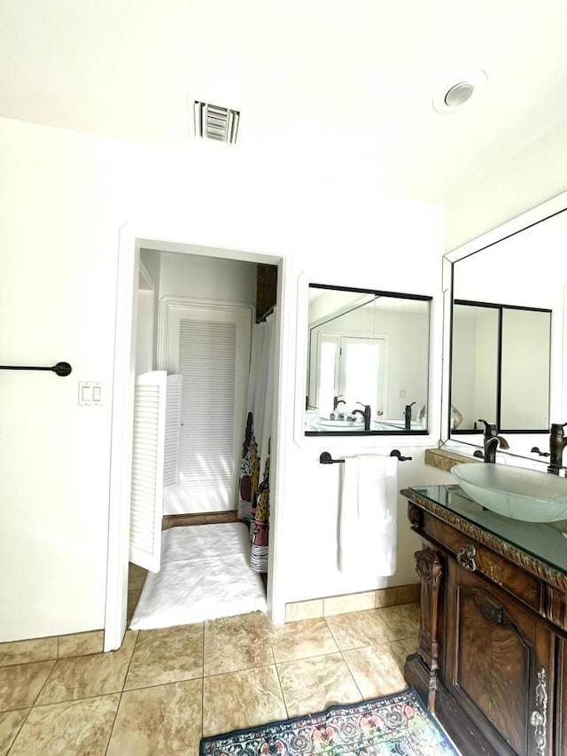 bathroom with vanity and tile patterned floors