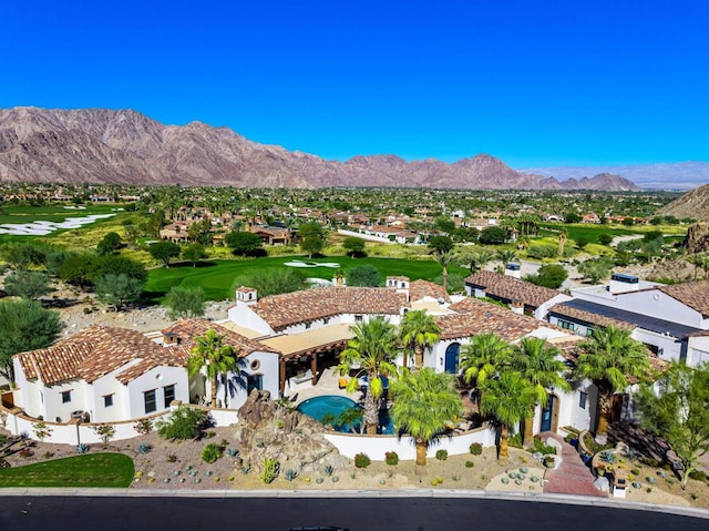 birds eye view of property featuring a mountain view