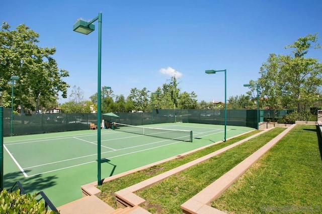 view of tennis court featuring basketball court