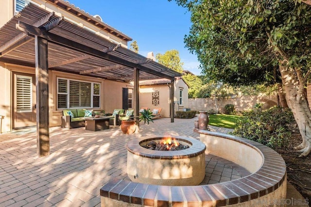 view of patio / terrace with a pergola and an outdoor fire pit