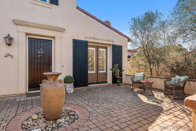 doorway to property featuring a patio area