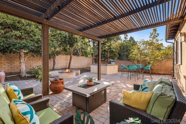 view of patio / terrace featuring an outdoor living space with a fire pit