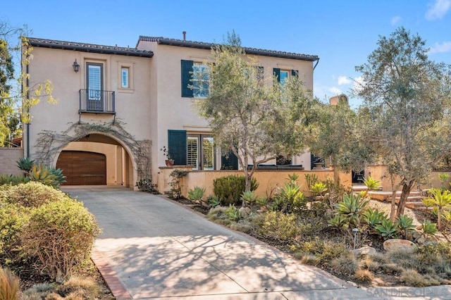 mediterranean / spanish home with a garage