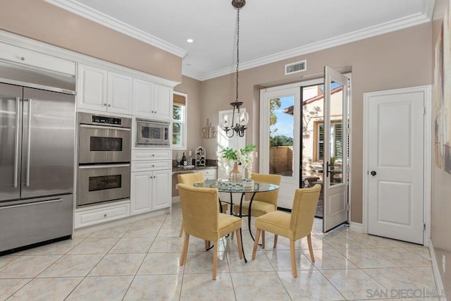 tiled dining area featuring a chandelier, plenty of natural light, and crown molding