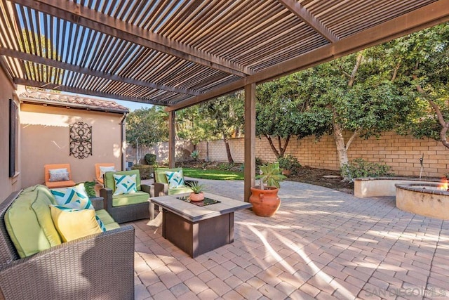 view of patio / terrace with a pergola and an outdoor living space with a fire pit