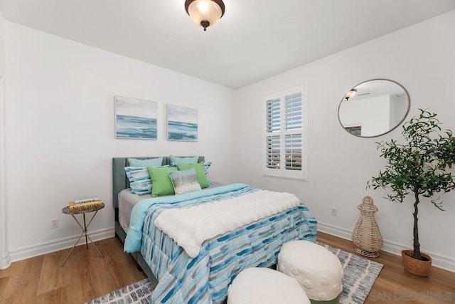 bedroom with hardwood / wood-style flooring