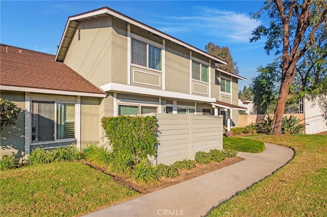 view of home's exterior featuring a lawn