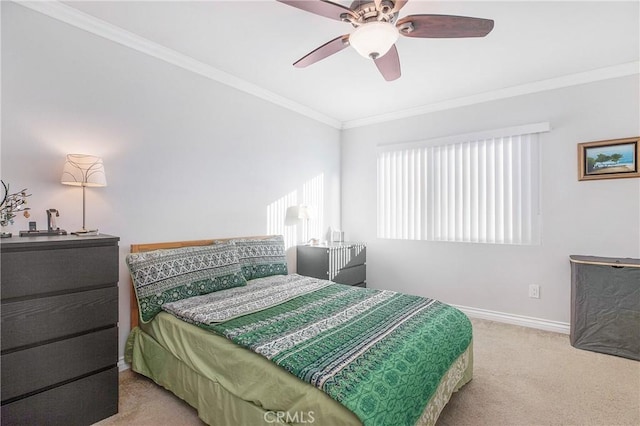 bedroom featuring ceiling fan, crown molding, and light carpet