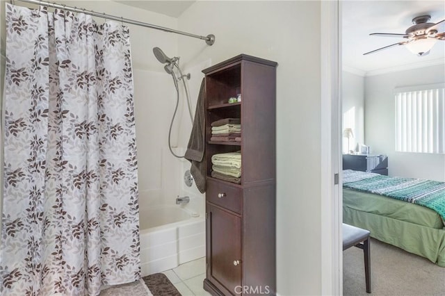 bathroom featuring ceiling fan, tile patterned flooring, shower / bath combination with curtain, and ornamental molding