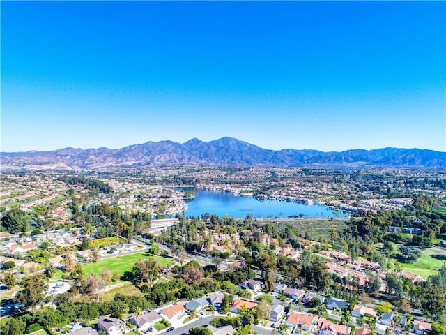 drone / aerial view featuring a water and mountain view