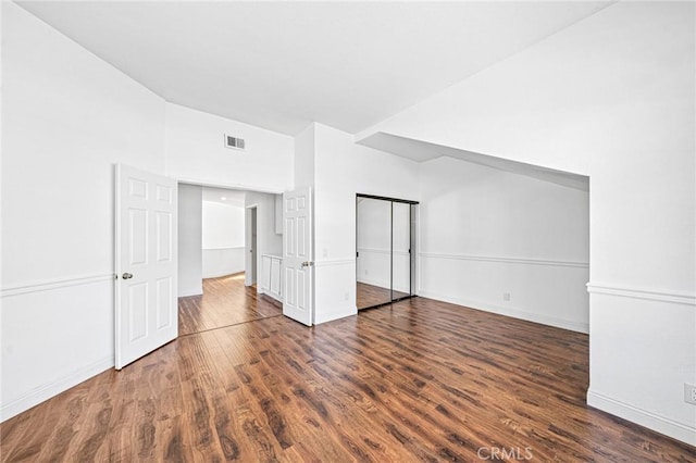 additional living space featuring dark hardwood / wood-style flooring