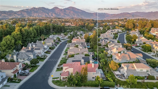 birds eye view of property with a residential view and a mountain view