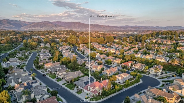 birds eye view of property featuring a residential view and a mountain view