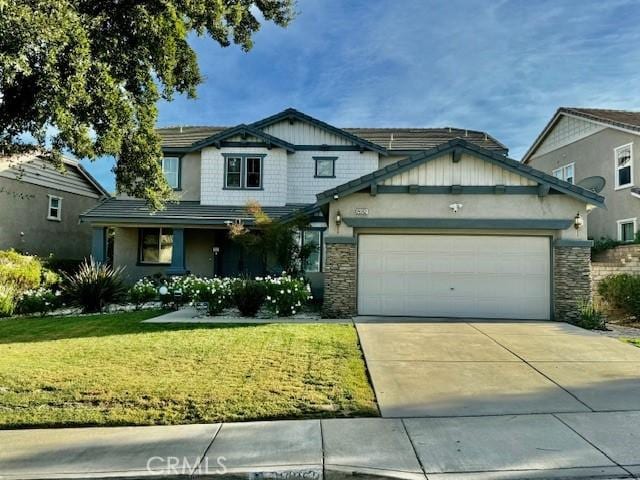 craftsman-style house with a garage and a front yard