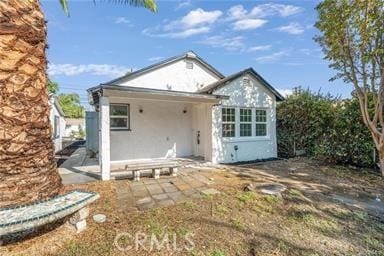 rear view of property with a patio