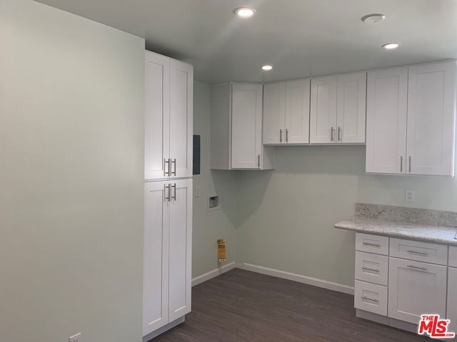 laundry room featuring dark hardwood / wood-style flooring and washer hookup