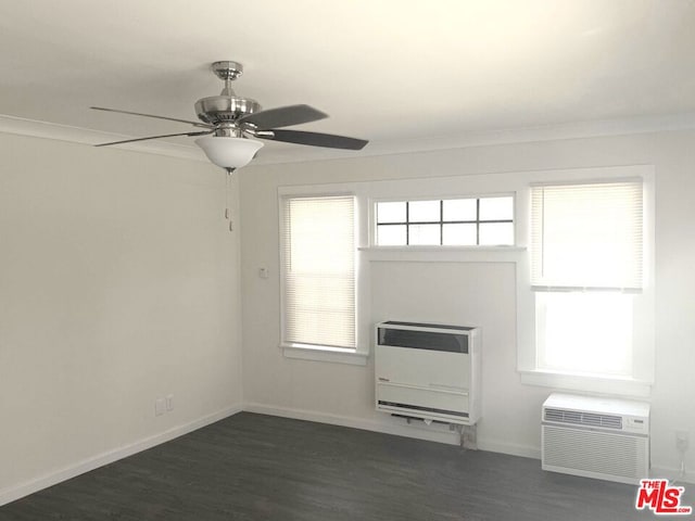 unfurnished room with ornamental molding, heating unit, a wall mounted AC, ceiling fan, and dark hardwood / wood-style floors