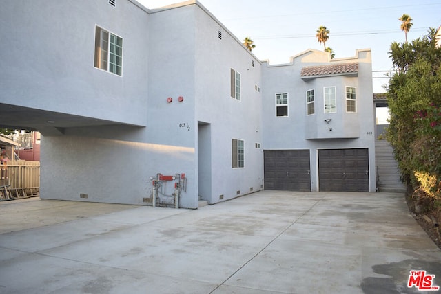 view of property exterior featuring a garage