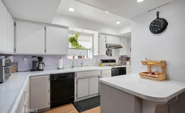 kitchen with dishwasher, white range with electric cooktop, white cabinets, sink, and light wood-type flooring