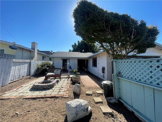 back of house with a patio area