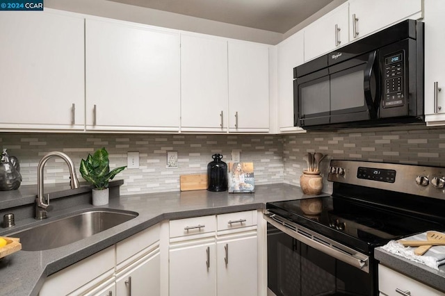 kitchen with white cabinets, stainless steel electric range, decorative backsplash, and sink