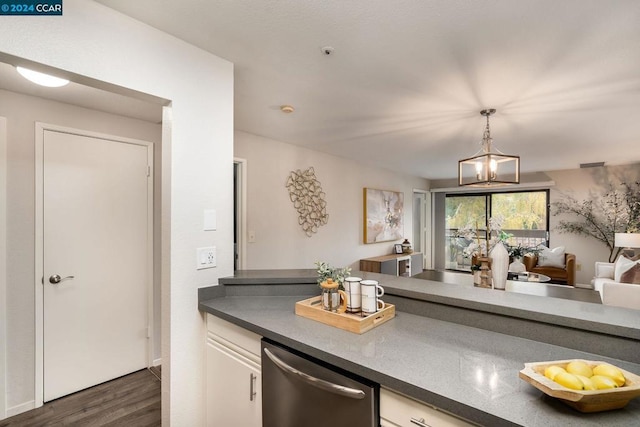 kitchen featuring dishwasher, dark wood-type flooring, decorative light fixtures, and an inviting chandelier