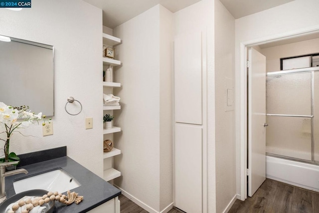 bathroom with vanity and wood-type flooring