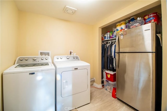 laundry area featuring independent washer and dryer