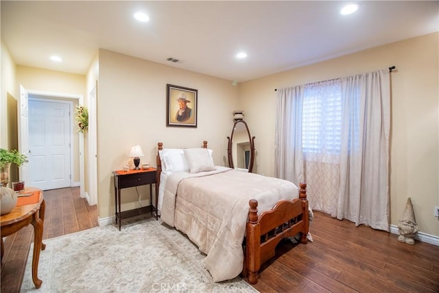 bedroom with hardwood / wood-style floors