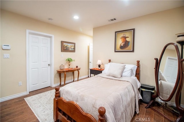 bedroom featuring dark hardwood / wood-style floors