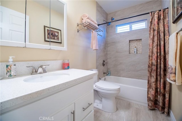 full bathroom featuring shower / bath combo with shower curtain, vanity, and toilet