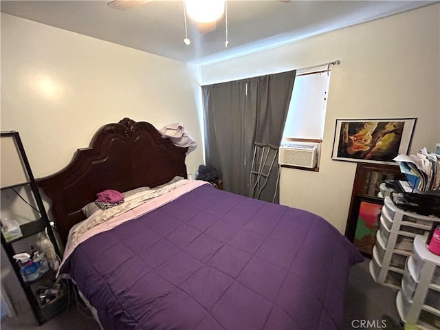 bedroom with ceiling fan and cooling unit