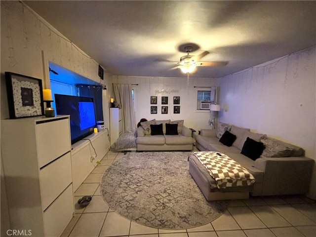 living room featuring ceiling fan, cooling unit, and light tile patterned floors