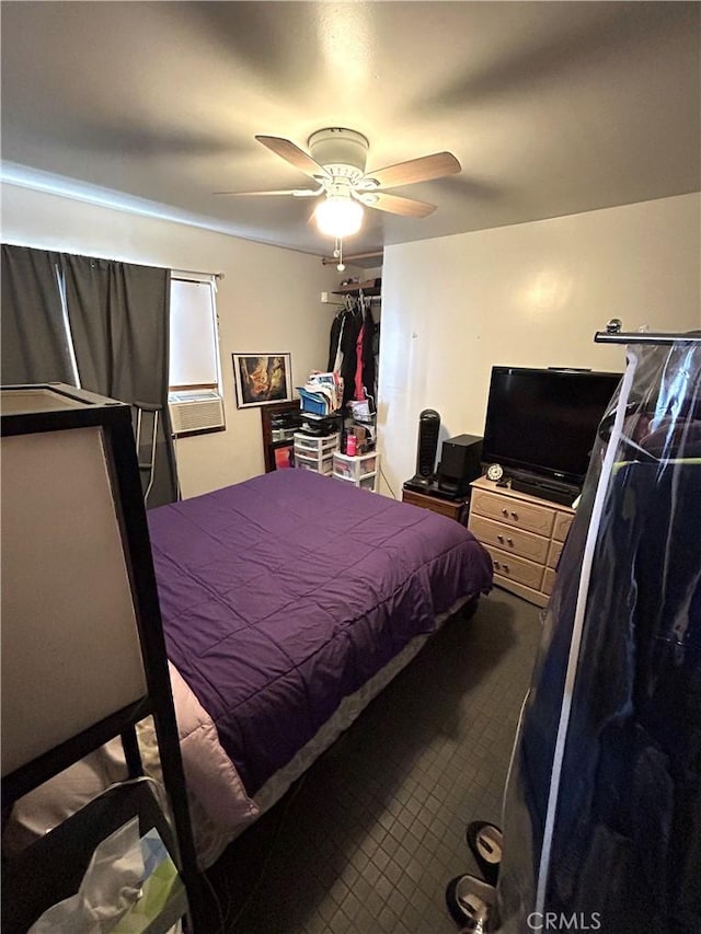 carpeted bedroom with ceiling fan and cooling unit