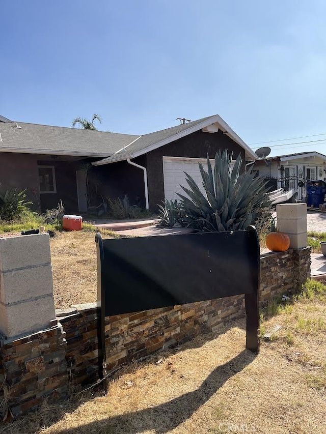 view of side of home featuring a garage