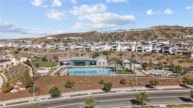 birds eye view of property featuring a mountain view