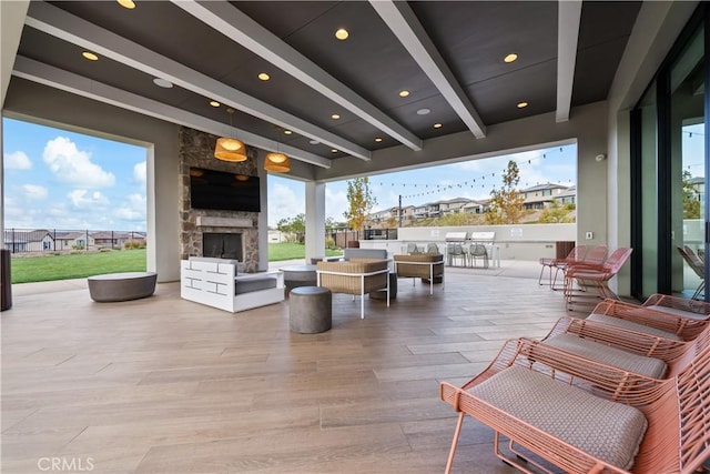 view of patio with an outdoor stone fireplace