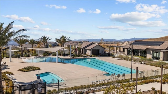 view of pool featuring a mountain view and a patio